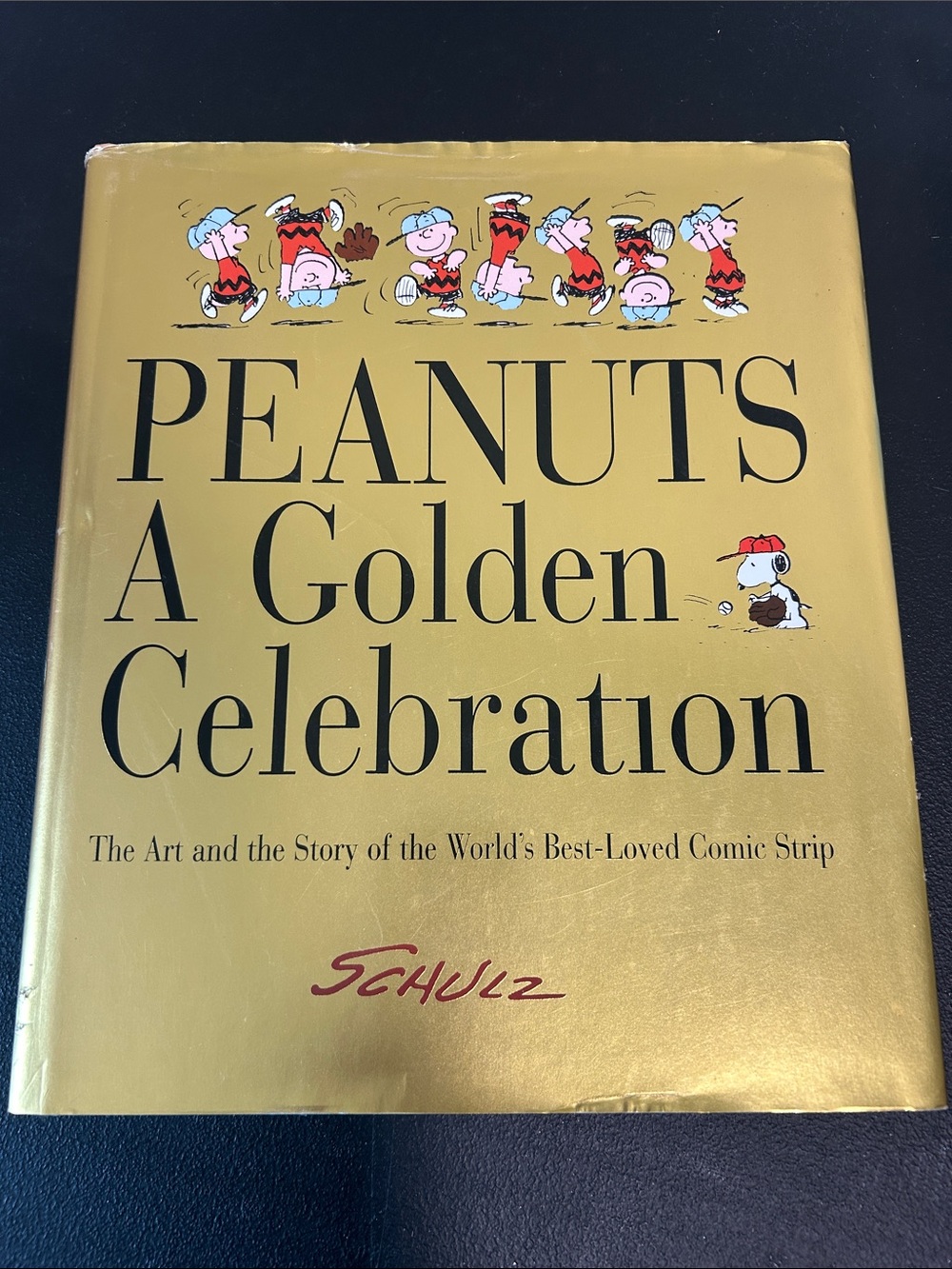 Peanuts Golden Celebration Coffee Table Book - Gold Cover. Charlie Brown